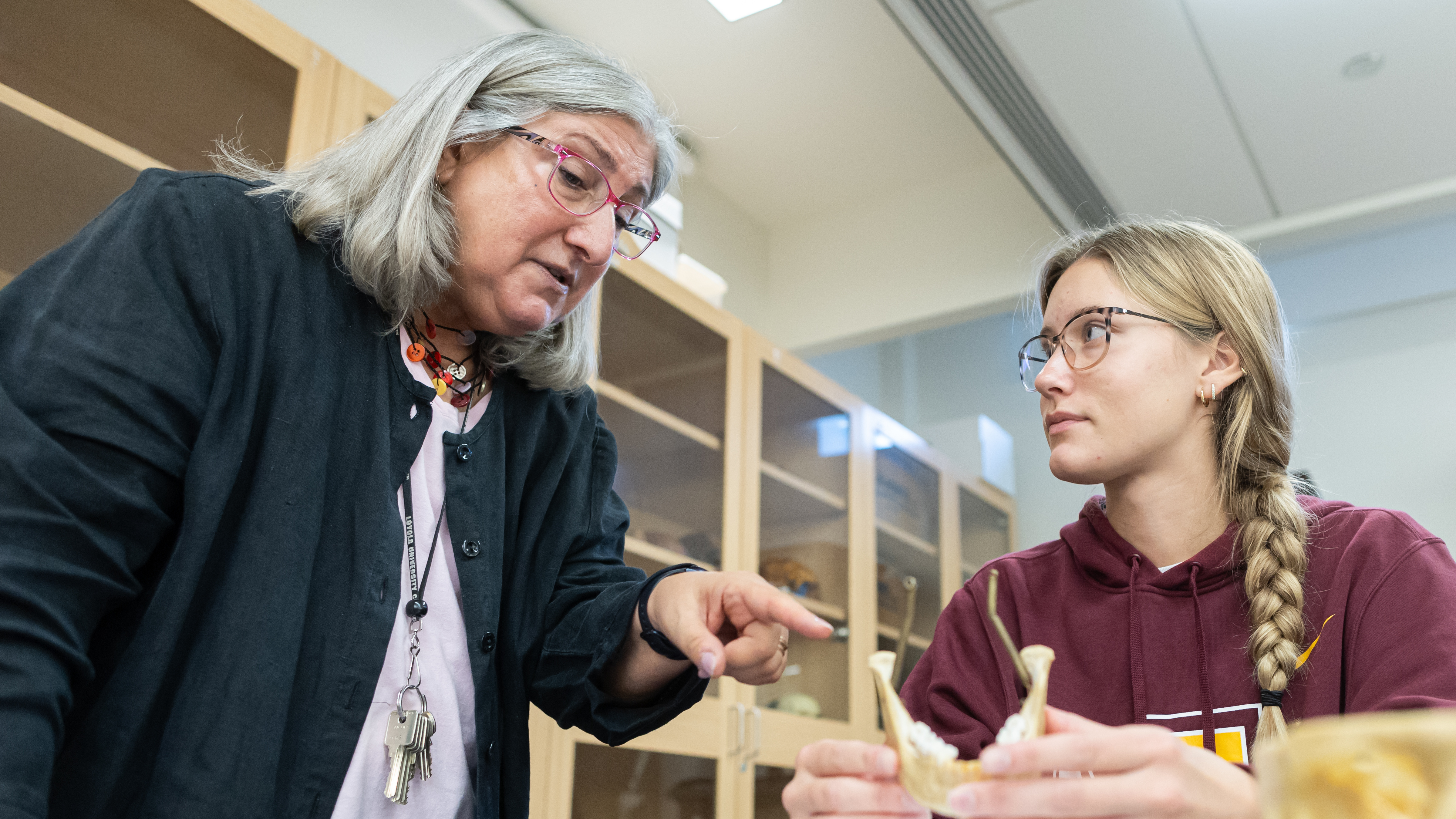 Professor Anne L. Grauer teaching a Loyola student